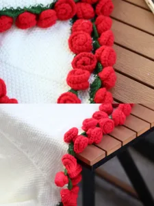 Exquisite handmade crochet rose blanket shawl detail showcasing intricate red floral edges.
