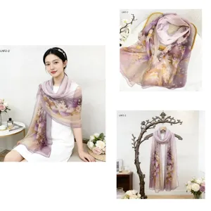 Floral print sheer long scarf detail shot showing delicate daisy pattern and lightweight fabric.