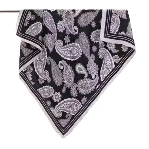 Classic black and white paisley pattern square scarf hanging display, elegant silk-like drape.