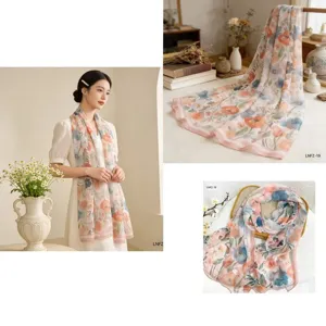 Detailed view of lightweight floral chiffon scarf, elegant draping and soft texture closeup.