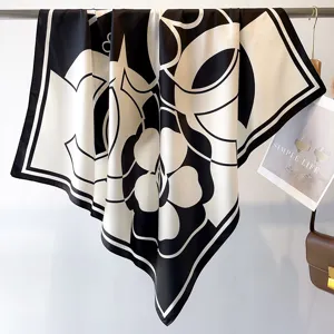 Classic black and white silk scarf with geometric floral pattern, elegant women fashion square.