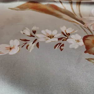 Detailed view of women's silk crepe de chine scarf showcasing elegant floral print texture.