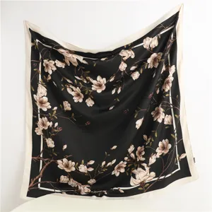 Classic black silk square scarf with elegant floral magnolia branch print for women fashion.