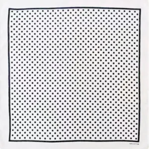 Detail view of a classic black and white polka dot cotton square scarf and retro bandana.