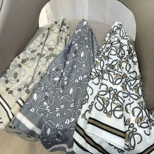 Elegant printed silk scarf for women, stylish patterned neckerchief and hair accessory.