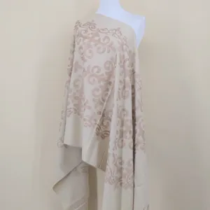 Close-up of soft imitation cashmere scarf with elegant totem embroidery for autumn winter warmth.