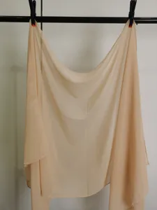 Detail view of lightweight pure color chiffon scarf, elegant drape for spring and summer wear.