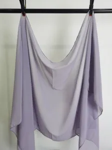 Detail view of a light purple solid chiffon scarf hanging, soft lightweight fabric texture display.