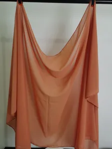 Solid color chiffon scarf fabric detail, lightweight breathable summer shawl wrap accessory.