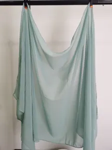 Detailed view of a solid color light green chiffon scarf, lightweight and elegant for daily wear.