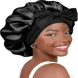 Black satin sleep cap with bow, double layer night cap for hair care and styling protection.