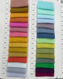 Cotton linen fabric color swatch card showing numbers 31 to 60 for custom apparel choices.