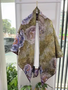 Detailed view of traditional Chinese style floral printed silk shawl cape, elegant textile craft.