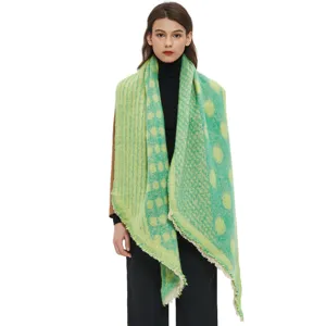 Detail view of women's autumn winter thick jacquard polka dot triangle scarf shawl.