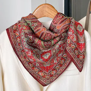 Detailed view of a vintage red paisley cotton linen square scarf draped elegantly.