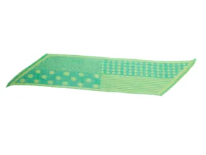Detailed view of the green jacquard patterned scarf with polka dots and unique diagonal shape.