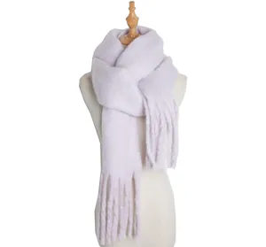 Close-up detail of soft fluffy winter scarf in light purple color, warm texture, fringe ends.