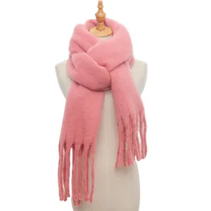 Pink winter knit fringe scarf detail, soft cozy loop yarn material for women cold weather.