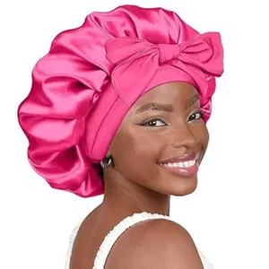 Pink satin hair bonnet with bow for women, large double layer night sleep cap for curly hair.