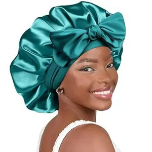 Dark green satin hair bonnet for women, large double layer sleep cap with bow detail.
