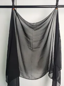 Black chiffon scarf detail showing lightweight sheer fabric, elegant drape and solid color design.