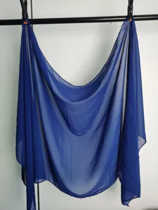 Close-up detail of the lightweight solid blue chiffon scarf, soft and breathable fabric.