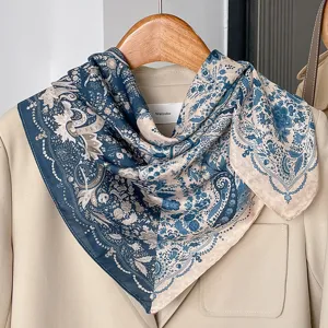 Detailed view of the vintage blue and beige paisley printed cotton linen square scarf.