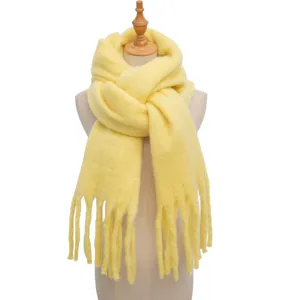 Solid color winter fluffy scarf detail, cozy loop yarn texture with cute tassels for women.