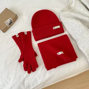 Red winter knitted hat scarf and gloves set, warm wool blend thick thermal three-piece apparel.
