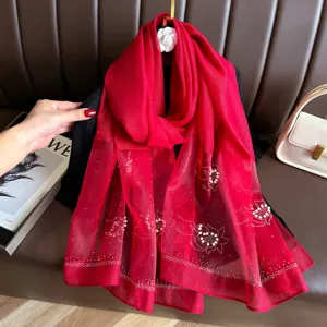 Red faux silk scarf with pearl rhinestone flower details, lightweight and elegant accessory.