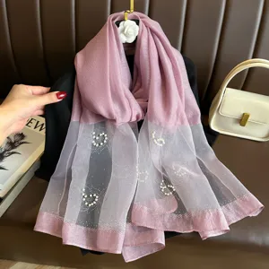 Pink imitation silk scarf detail, elegant pearl and rhinestone floral decoration for women.