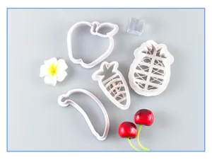 Detailed view of fruit shape pastry dough cutters set for baking cute buns and pastries.