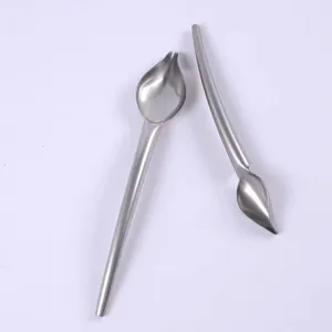Stainless steel culinary decorating spoon for plating chocolate, sauce, and baking art. Detail view.