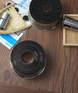 Detail view of the 12-piece stainless steel round and fluted cookie and pastry cutter set.