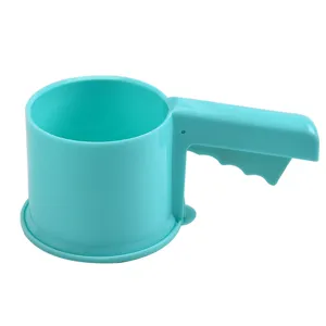 Cyan plastic hand held flour sifter detail view, manual baking powder filter tool for kitchen.