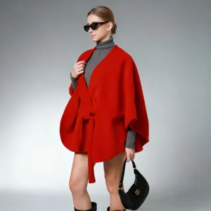 Red imitation cashmere cape for women, stylish winter poncho with waist belt for new year.