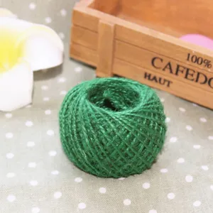 Green jute twine ball detail shot, ideal for DIY crafts, gift box packaging and baking decor.