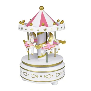 Detailed view of a charming pink and white carousel music box with golden star accents.