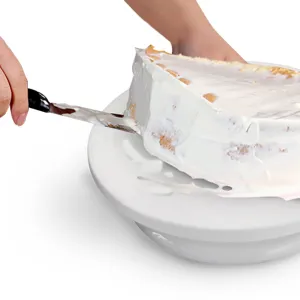 Plastic cake turntable rotating stand with non-slip edge for baking and decorating cakes.