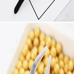 Stainless steel tweezers for cake decorating, fine curved tip with protective cap for sugar pearls.