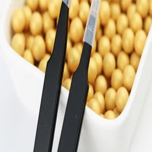Stainless steel tweezers for cake decorating and sugar pearls, fine precision baking tool.