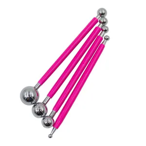 Set of 4 double-ended metal ball tools with pink handles for polymer clay and fondant crafts.