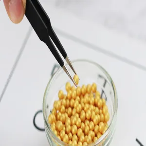 Stainless steel precision tweezers for cake decoration and baking, fine pointed craft tool.