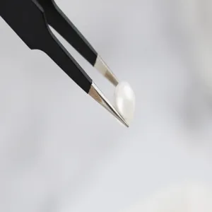 Precision stainless steel tweezers detail view, fine pointed anti-static baking tool for decoration.