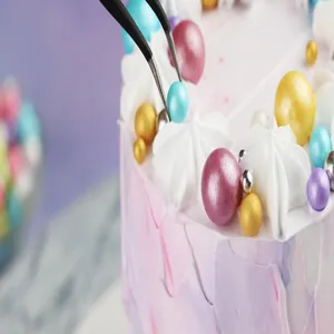Precision stainless steel curved tweezers for cake decoration and baking crafts detail shot.