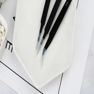 Precision stainless steel tweezers with protective caps for cake decoration and fine craft work.