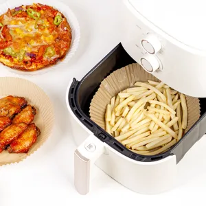 Disposable air fryer paper liners, round parchment baking paper sheets for roasting and cooking.