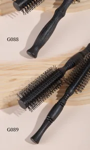 Professional black wooden hair roller brush with fine bristles for styling and curling hair.