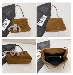 Vintage brown suede shoulder bag with cute rabbit pendant and elegant classic design style.
