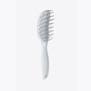 White curved vent hair brush detangling comb for smooth styling and daily hair care routine.